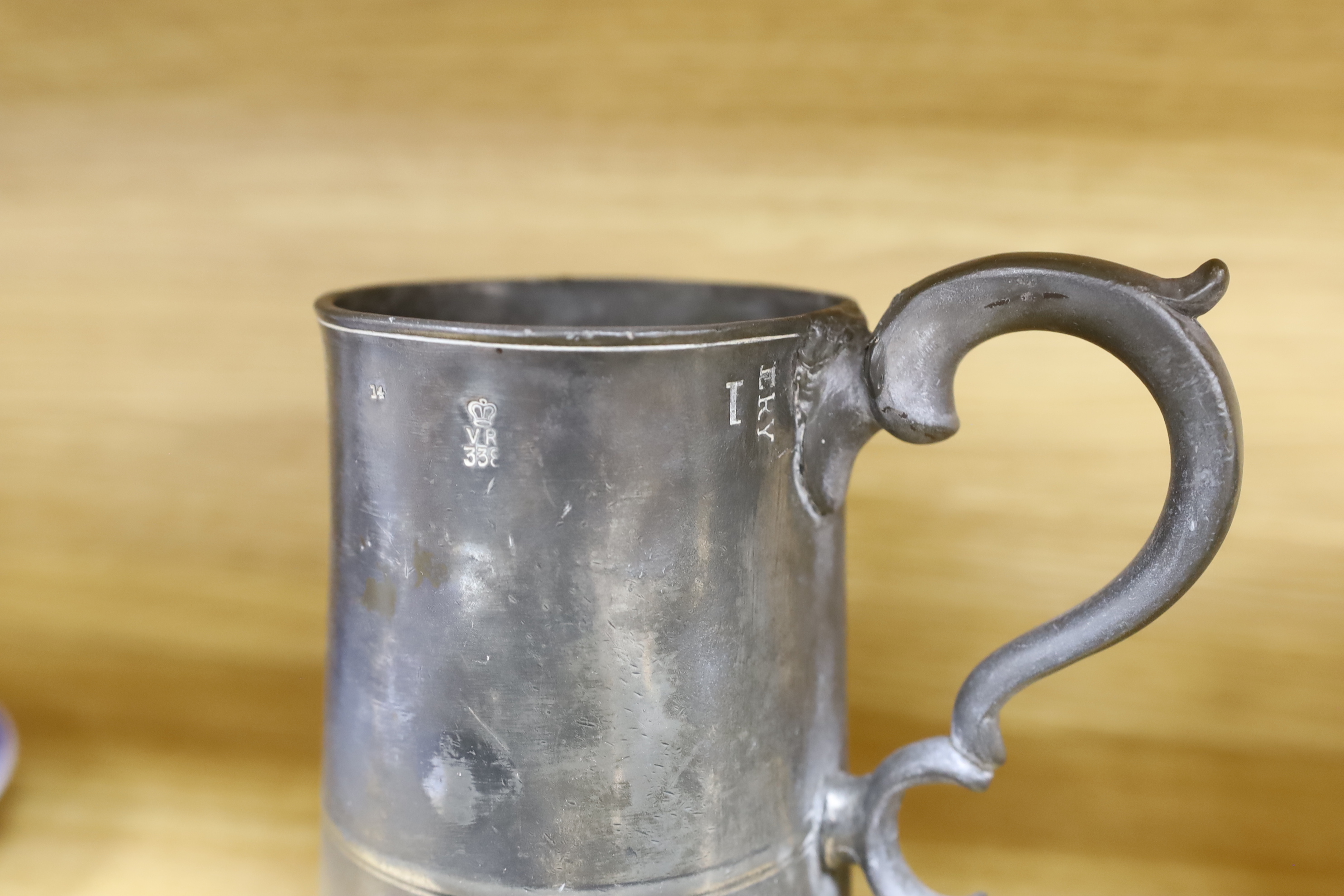 A collection of 19th century pewter ale mugs pewter measures and a mustard pot tallest 16.5 cm high